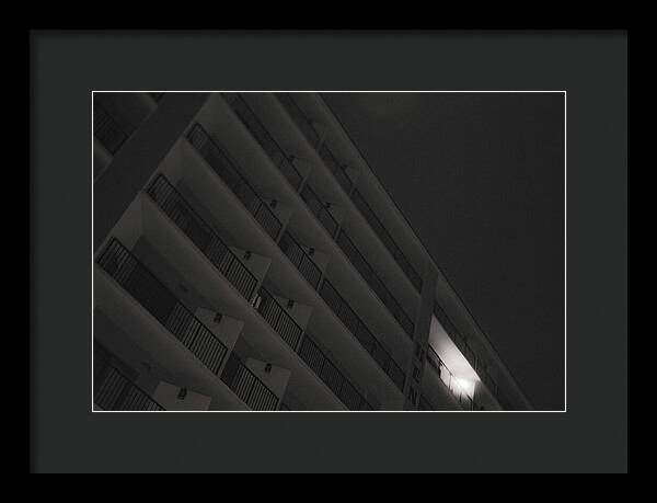 Dimly Lit Beach Hotel Building at Night - Framed Print
