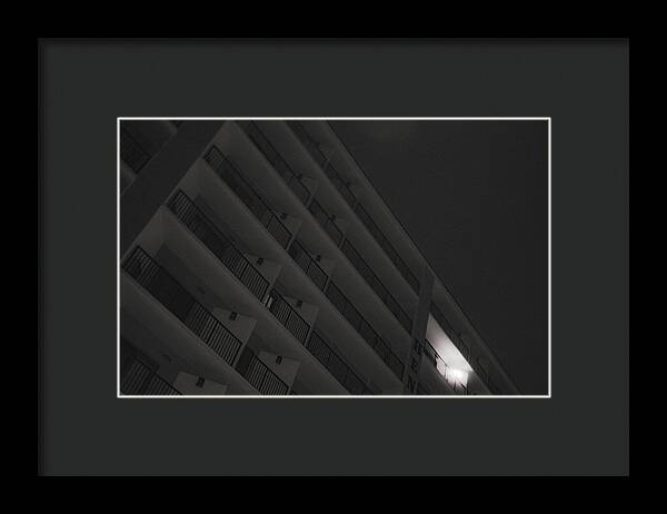 Dimly Lit Beach Hotel Building at Night - Framed Print