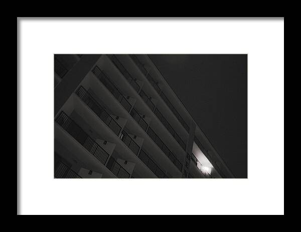Dimly Lit Beach Hotel Building at Night - Framed Print