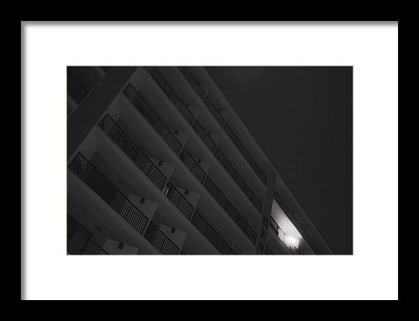 Dimly Lit Beach Hotel Building at Night - Framed Print