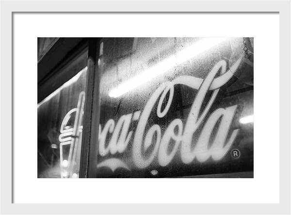 Neon Coca-Cola Sign on Window - Framed Print