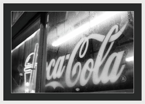 Neon Coca-Cola Sign on Window - Framed Print