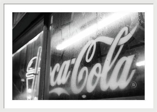 Neon Coca-Cola Sign on Window - Framed Print