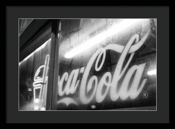 Neon Coca-Cola Sign on Window - Framed Print